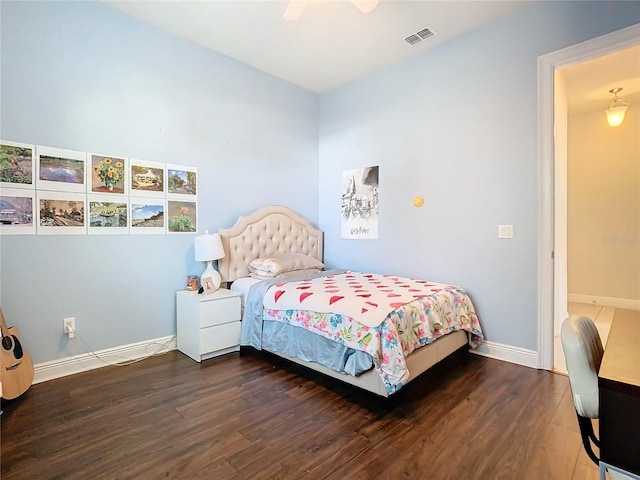 bedroom featuring ceiling fan and dark hardwood / wood-style flooring