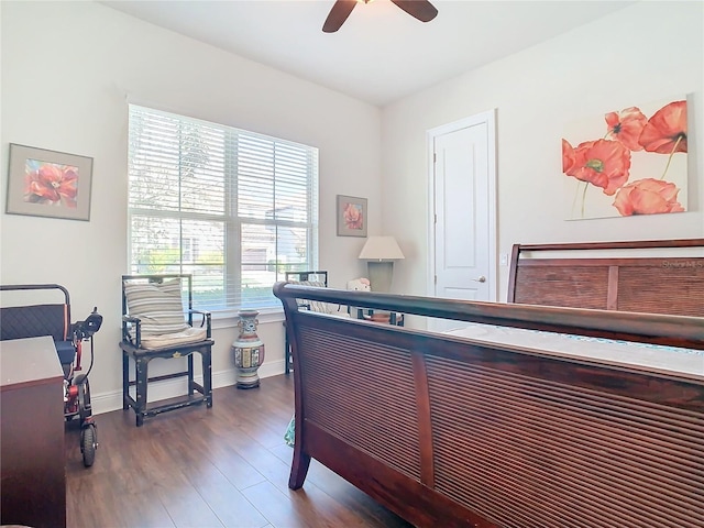 bedroom featuring dark wood-type flooring and ceiling fan