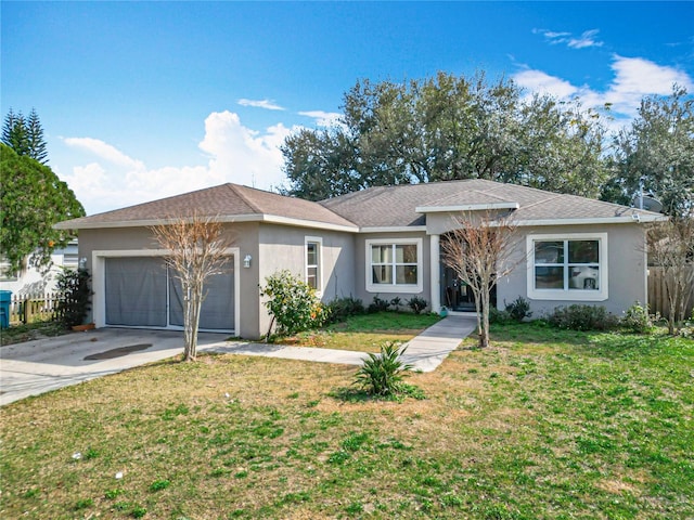 ranch-style home featuring a garage and a front lawn