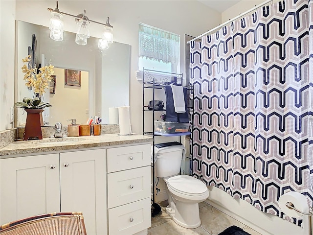 full bathroom featuring shower / bath combination with curtain, vanity, tile patterned floors, and toilet