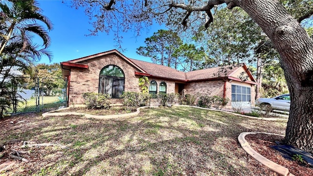 ranch-style house with a front yard