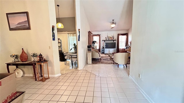 tiled foyer with vaulted ceiling