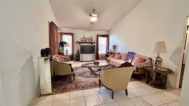 living room with lofted ceiling and light tile patterned floors