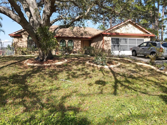 single story home featuring a front yard