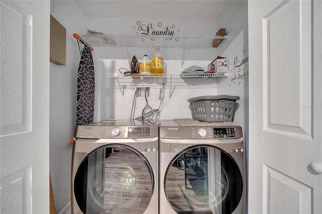 washroom featuring washing machine and clothes dryer