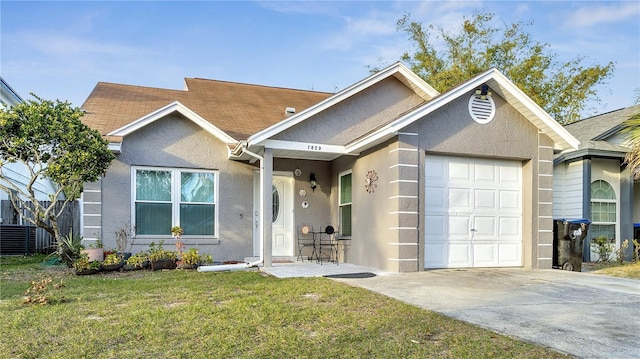 view of front facade with a garage and a front yard