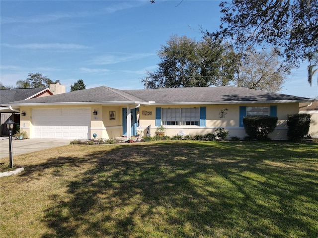 ranch-style home with a garage and a front lawn