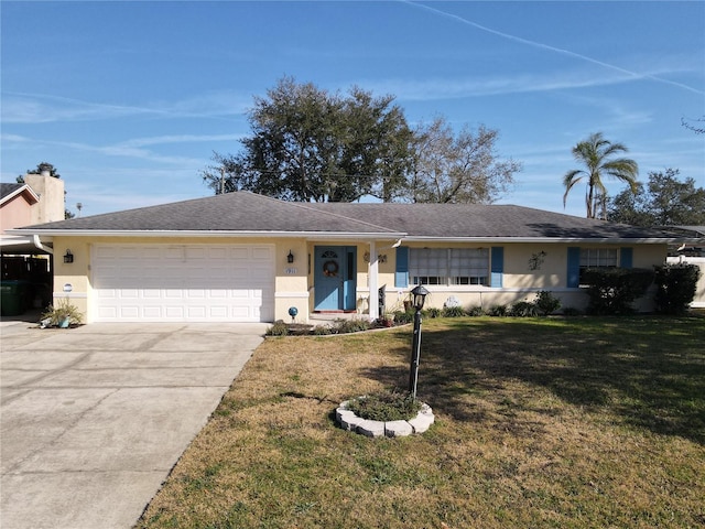 single story home with a garage and a front lawn