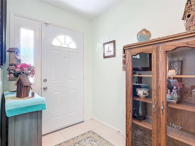 entrance foyer with light tile patterned flooring