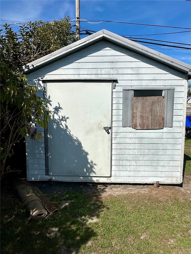 view of home's exterior with a storage unit