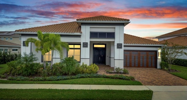 mediterranean / spanish house featuring a garage