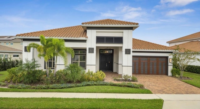 mediterranean / spanish home featuring a garage