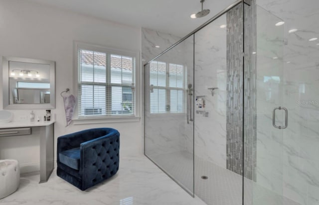 bathroom with vanity and a shower with shower door