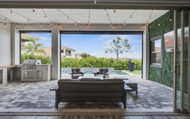 view of patio with an outdoor living space and area for grilling