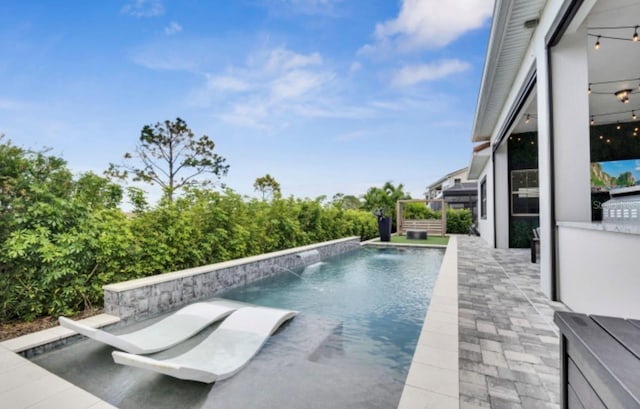 view of pool with pool water feature