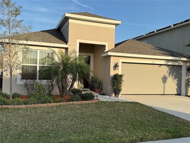 view of front of home featuring a garage and a front yard