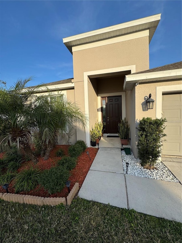 doorway to property featuring a garage