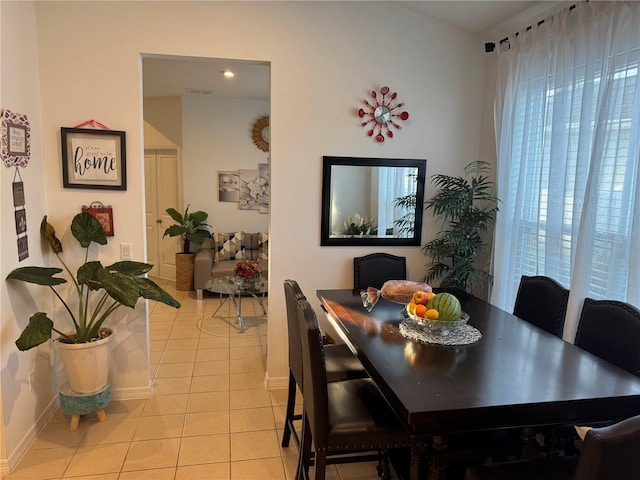 dining area with light tile patterned flooring