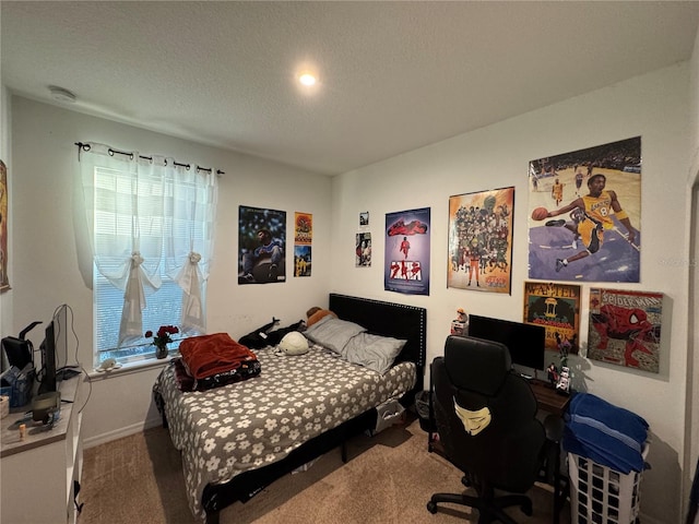 carpeted bedroom with a textured ceiling