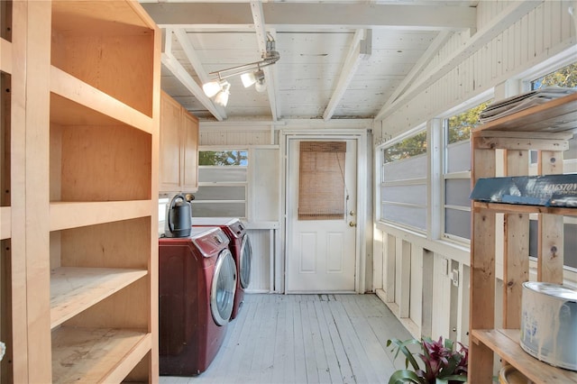 storage room with separate washer and dryer