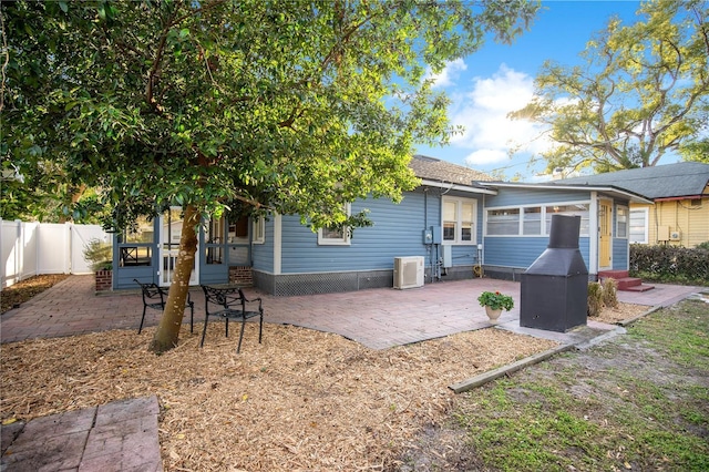 rear view of house with a patio