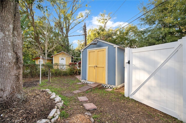 view of shed with a fenced backyard