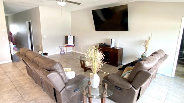 tiled living room featuring ceiling fan