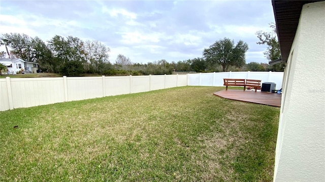 view of yard featuring central AC and a patio