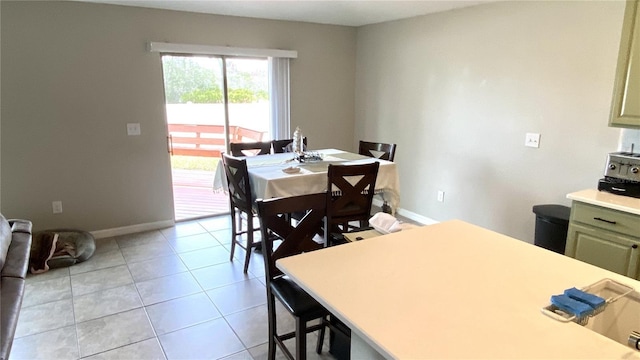 dining space with light tile patterned floors