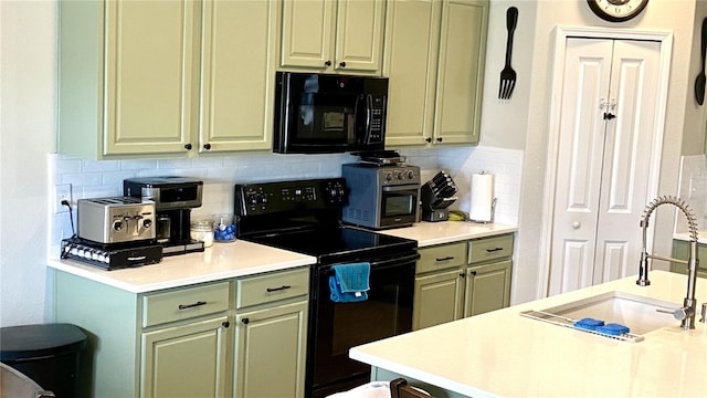 kitchen with tasteful backsplash, sink, and black appliances