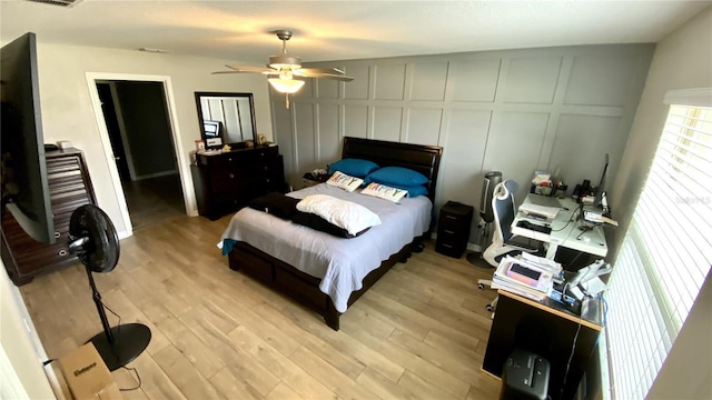 bedroom featuring ceiling fan and light hardwood / wood-style floors