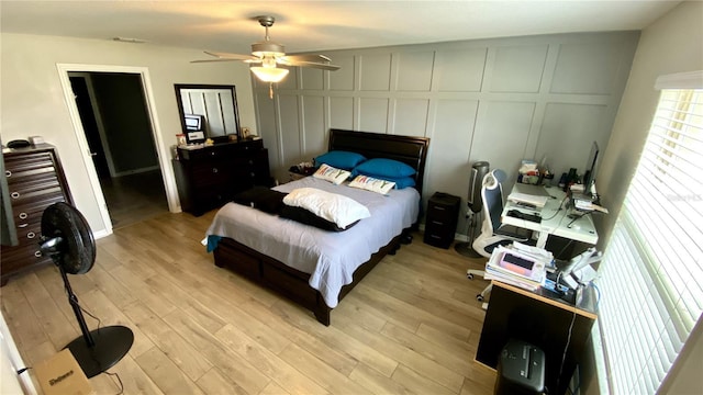 bedroom featuring ceiling fan and light hardwood / wood-style flooring