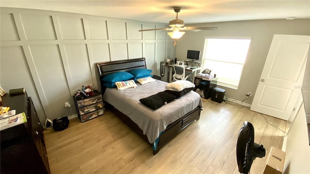 bedroom featuring ceiling fan and light hardwood / wood-style flooring