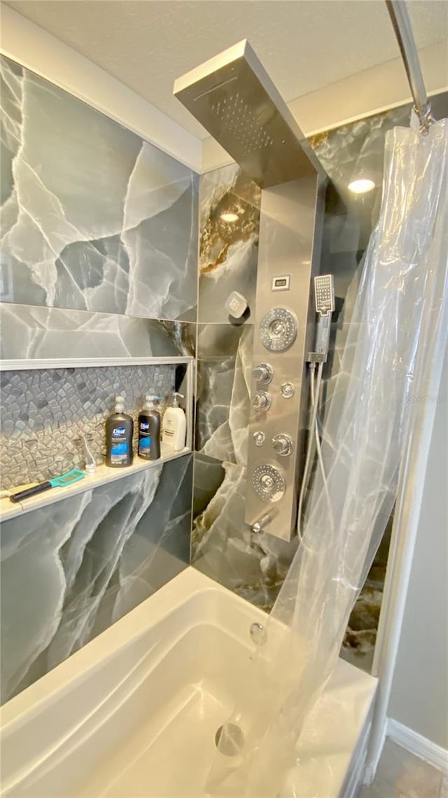 bathroom featuring shower / bath combo with shower curtain