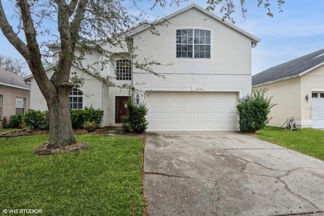 front of property with a garage and a front lawn