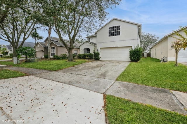 view of front property with a garage and a front yard