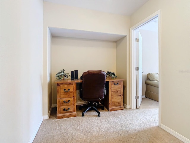 office area featuring light colored carpet