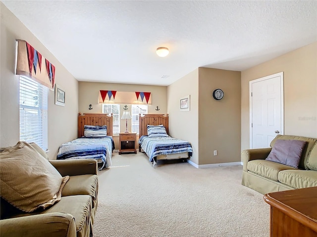 carpeted bedroom featuring multiple windows and a textured ceiling