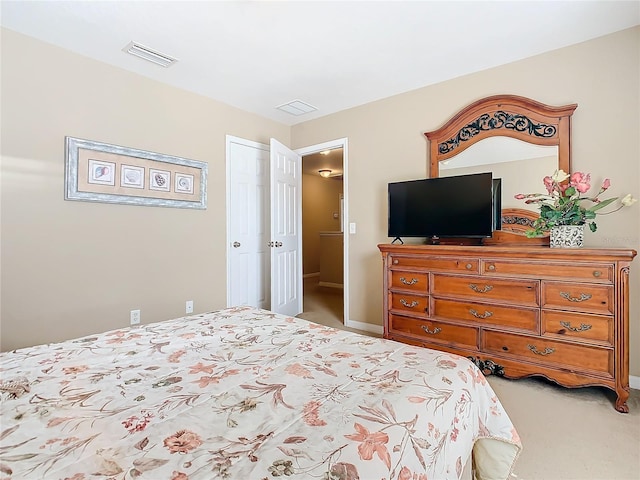 bedroom with light carpet