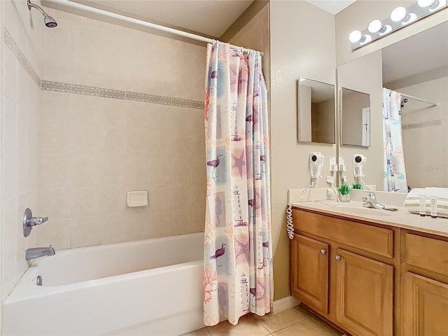 bathroom featuring tile patterned flooring, shower / tub combo, and vanity