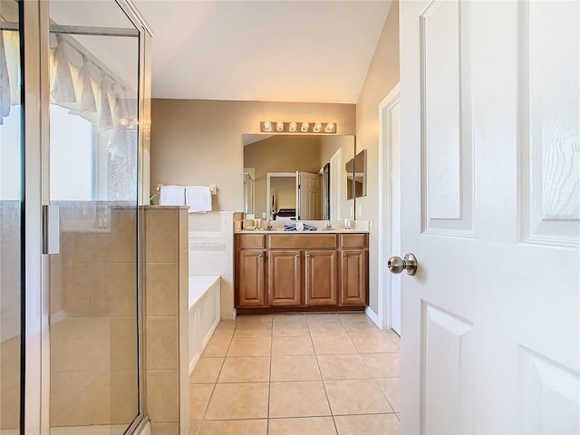 bathroom featuring plus walk in shower, tile patterned floors, and vanity