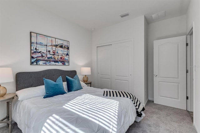 carpeted bedroom featuring a closet