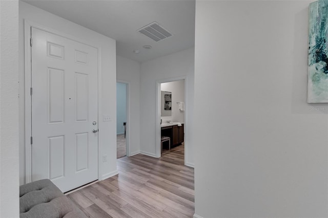 corridor featuring light hardwood / wood-style flooring