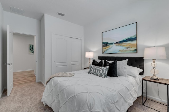 carpeted bedroom with a closet