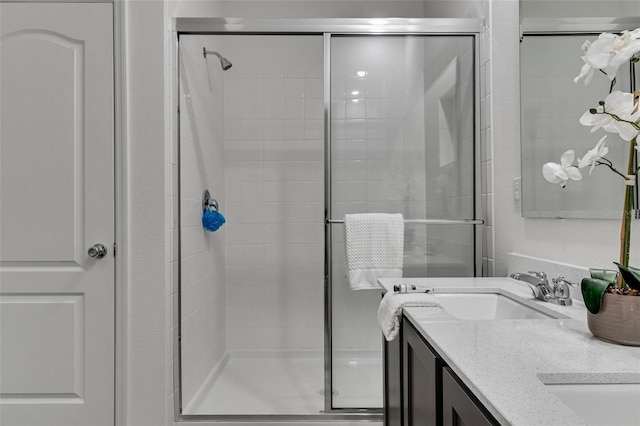 bathroom featuring vanity and walk in shower