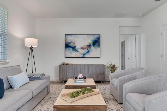 living room with light hardwood / wood-style flooring