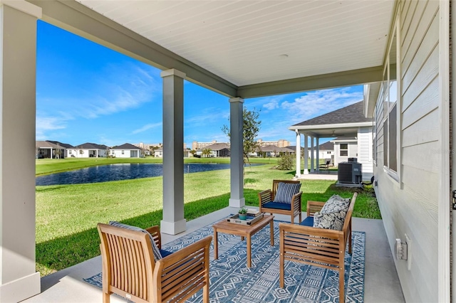 view of patio / terrace with a water view, an outdoor hangout area, and cooling unit