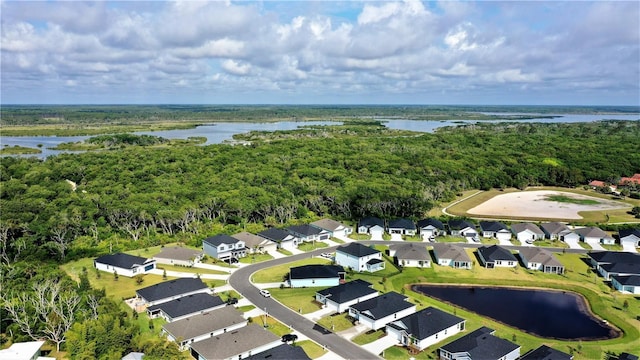 bird's eye view with a residential view, a water view, and a forest view