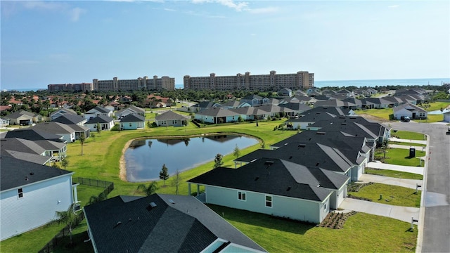 bird's eye view featuring a water view and a residential view