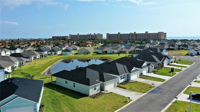 birds eye view of property featuring a water view